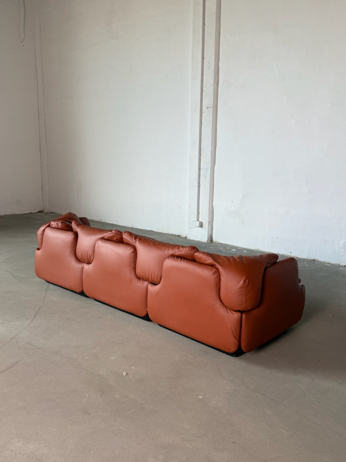 CONFIDENTIAL terracotta brown leather sofa