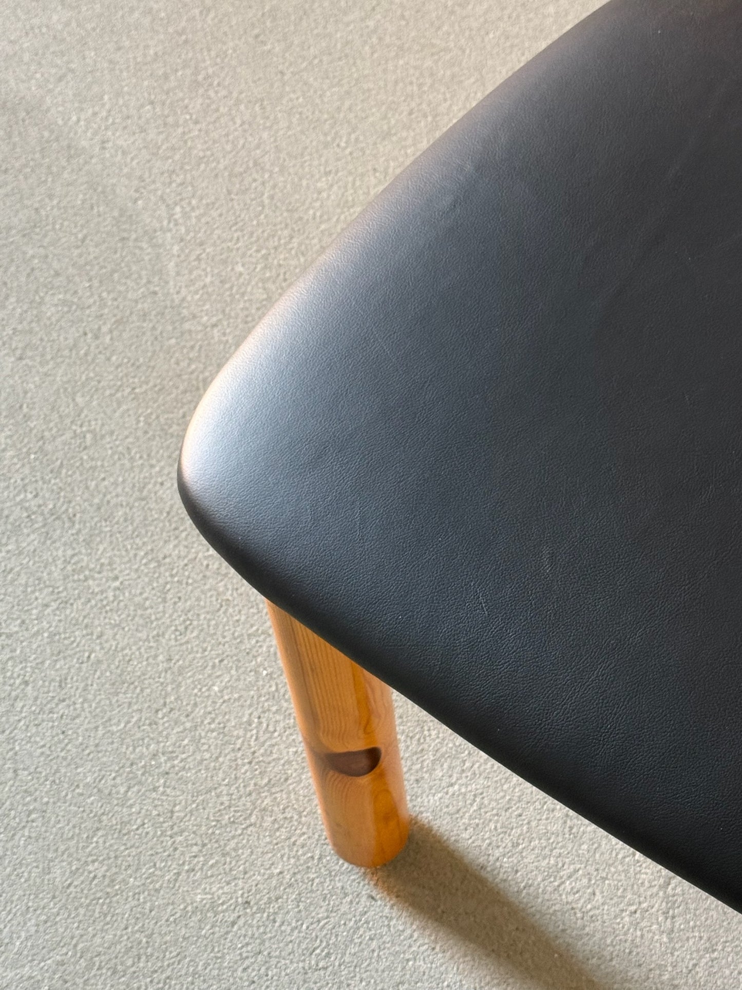 Wooden Daumiller chairs with black leather seats