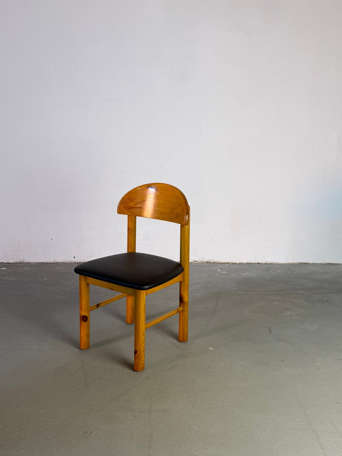 Wooden Daumiller chairs with black leather seats